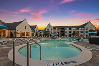 Resort-style pool with tanning ledges